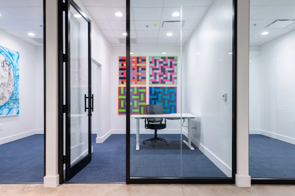 inside of coworking executive office with glass doors and new furniture